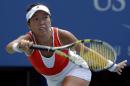 Vania King, of the United States, returns a shot to Serena Williams, of the United States, during the second round of the 2014 U.S. Open tennis tournament, Thursday, Aug. 28, 2014, in New York. (AP Photo/Elise Amendola)