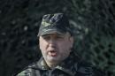 Ukraine's acting President Turchinov speaks with the media during a military exercise near the village of Goncharivske