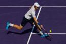 Andy Murray of Great Britain returns a ball against Dominic Thiem of Austria during day 10 of the Miami Open at Crandon Park Tennis Center on April 1, 2015 in Key Biscayne, Florida