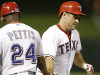 Texas Rangers designated hitter Lance Berkman, right,  gets a congrats from third base coach Gary Pettis, left, as he rounds the bases after hitting a two-run homer in the seventh inning of a baseball game against the Cleveland Indians Monday, June 10, 2013, in Arlington, Texas.  Texas Elvis Andrus scored on the play and the Rangers won 6-3.  (AP Photo/LM Otero)