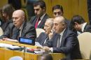 In this photo provided by the United Nations, Mevlut Cavusoglu, right, Foreign Minister of Turkey, attends a meeting of the U.N. General Assembly, Thursday, Oct. 16, 2014 at U.N. headquarters. (AP Photo/United Nations, Mark Garten)