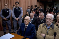 Former dictators Jorge Rafael Videla, second from right, and Reynaldo Bignone, right, wait to listen the verdict of Argentina's historic stolen babies trial in Buenos Aires, Argentina, Thursday, July 5, 2012. The two former dictators and a handful of other retired military and police officials are accused of systematically stealing babies from leftists who were kidnapped and killed when a military junta ran the country three decades ago. (AP Photo/Natacha Pisarenko)