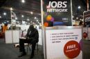 Job-seeker completes an application at a career fair held by civil rights organization National Urban League as part of its annual conference, in Philadelphia
