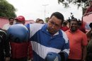 Venezuela's President Chavez poses using boxing gloves during a campaign rally in Acarigua
