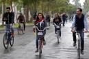 Marina Jaber (C), known as "the girl on the bike", campaigns for the freedom of women to ride bikes in Iraq