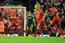 Liverpool's Jordan Rossiter, left, celebrates the opening goal during the English League Cup Third Round match Liverpool against Middlesbrough at Anfield, Liverpool, England, Tuesday Sept. 23, 2014. (AP Photo/PA, Peter Byrne) UNITED KINGDOM OUT NO SALES NO ARCHIVE