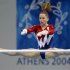 Carly Patterson of the U.S. performs a routine on the asymmetric bars during the women's artistic gy..