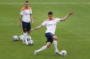 Robin van Persie, right, kicks the ball while Jordy Clasie, left, of the Netherlands waits his turn during a training session in Rio de Janeiro, Brazil, Tuesday, June 10, 2014. The Netherlands play in group B of the 2014 soccer World Cup. (AP Photo/Wong Maye-E)