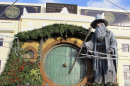 People walk by the Embassy Theater where a giant statue of the character Gandalf from the upcoming movie "The Hobbit: An Unexpected Journey" overlooks the passersby in Wellington, New Zealand, Monday, Nov. 19, 2012. Animal wranglers involved in the making of 