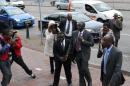 Kenyan Deputy President William Ruto (C) arrives with his fellow crimes against humanities accused Joshua Arap Sang on September 23, 2013 at the International Criminal Court in The Hague