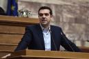 Greek Prime Minister Alexis Tsipras speaks to his parliamentary group in Athens on February 17, 2015