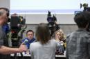 In this Friday May 13, 2016 picture Ppolice captain Markus Gisin, left, and prosecutor Barbara Loppacher, right inform the media in Schafisheim, Switzerland. about the killing of a family in Rupperswil in December. Officials in the nearby Swiss town of Rupperswil are expressing shock after the arrest of a 33-year-old soccer coach over the killing of four people. The Swiss man, identified by local media as Thomas N., is suspected of killing a mother, her two sons and the older son's girlfriend in December. Prosecutors say the suspect made a 