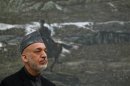 Afghan President Karzai speaks during a news conference in Kabul