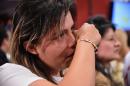 A woman cries after knowing the results of a referendum on whether to ratify a historic peace accord to end a 52-year war between the state and the communist FARC rebels, in Bogota on October 2, 2016