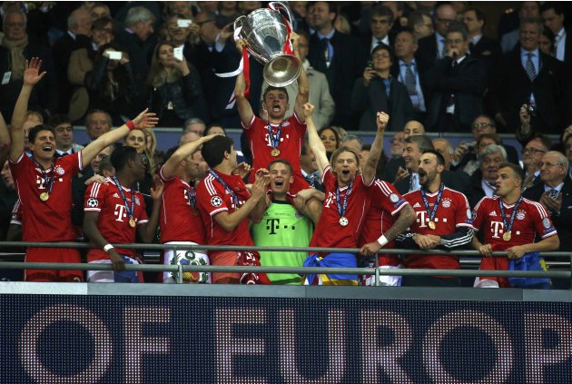Bayern Munich's players celebrate with the Champions League Trophy after defeating Borussia Dortmund in their Champions League Final soccer match at Wembley Stadium in London
