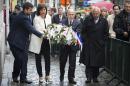 Belgian Vice-Prime Minister Joelle Milquet (2nd L), French Interior Minister Bernard Cazeneuve (C), and Brussels Jewish Museum President Philippe Blondin (Center R) on June 4, 2014 honour of the victims of a May 24 Jewish Museum shooting in Brussels