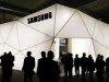 Visitors are seen in front of Samsung stand during the Mobile World Congress at Barcelona