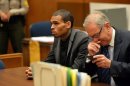 R&B singer Chris Brown, left, and his Attorney Mark Geragos appear during a court hearing at Los Angeles Superior court in Los Angeles Monday, July 15, 2013. A Los Angeles judge has revoked Chris Brown's probation after reading details of an alleged hit-and-run accident and his behavior afterward, but the singer was not ordered to jail. The prosecutor did not ask for Brown to be jailed. Another hearing is set for Aug. 16. The singer has been on felony probation in the 2009 beating of former girlfriend Rihanna. (AP Photo/Alberto E. Rodriguez, Pool)