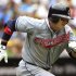 Indians batter Choo Shin-soo runs to first base during their MLB American League baseball game in Toronto