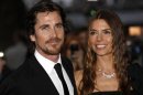 British actor Christian Bale and his wife Sibi pose for photographers as they arrive at the European Premiere of "The Dark Knight Rises" in Leicester Square