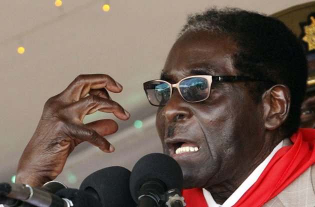 Zimbabwe's President Robert Mugabe gestures as he speaks during an event marking his 89th birthday at Chipadze stadium in Bindura, about 90 km (56 miles) north of the capital Harare March 2, 2013. Addressing a rally to mark his 89th birthday last week, Africa's oldest leader denied accusations by the rival Movement for Democratic Change (MDC) of Prime Minister Morgan Tsvangirai that ZANU-PF was playing dirty ahead of the presidential and parliamentary polls. REUTERS/Philimon Bulwayo (ZIMBABWE - Tags: POLITICS ENTERTAINMENT ELECTIONS)
