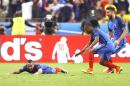 France's Dimitri Payet, left, celebrates with teammates Patrice Evra and Olivier Giroud, right, after scoring, during the Euro 2016 Group A soccer match between France and Romania, at the Stade de France, in Saint-Denis, north of Paris, Friday, June 10, 2016. (AP Photo/Frank Augstein)