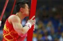 China's Chen Yibing kisses the apparatus after competing in the men's gymnastics rings final in the North Greenwich Arena during the London 2012 Olympic Games