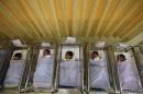 Babies lie in cots at a maternity ward in Singapore