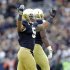 Notre Dame linebacker Manti Te'o celebrates after an interception against the BYU during the first half of an NCAA college football game in South Bend, Ind., Saturday, Oct. 20, 2012. (AP Photo/Michael Conroy)