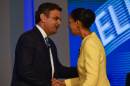 Brazilian presidential candidates Marina Silva (R) and Aecio Neves, greet each other before their last TV debate in Rio de Janeiro, Brazil, on October 2, 2014