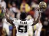 New Orleans Saints linebacker Jonathan Vilma celebrates the Saints overtime win against the Washington Redskins in Landover Maryland