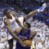 Oklahoma City Thunder forward Serge Ibaka, left, tumbles over Los Angeles Lakers center Andrew Bynum during the first quarter of Game 2 in an NBA basketball playoffs Western Conference semifinal, in Oklahoma City on Wednesday, May 16, 2012. (AP Photo/Sue Ogrocki)