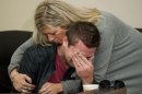 GRESHAM, OREGON - October 18, 2012 - Clint Heichel gets a hug from Lorilei Ritmiller, mother of Whitney Heichel, as he breaks down after he attempted to speak at a news conference Thursday Oct. 18, 2012 in the council chambers for the City of Gresham. (AP Photo/Brent Wojahn, The Oregonian)