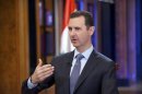 Syria's President Bashar al-Assad speaks during an interview with Fox News channel in Damascus