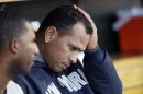 FILE - In this Oct. 18, 2012, file photo, New York Yankees' Alex Rodriguez watches from the dugout during Game 4 of the American League championship series against the Detroit Tigers in Detroit. Injuries have kept him off the field for more than half the season and now A-Rod faces discipline from Major League Baseball in its drug investigation, possibly up to a lifetime ban.(AP Photo/Paul Sancya, File)