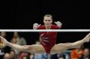 Sloan of the U.S. performs on the uneven bars during the women's team final of the Artistic Gymnastics World Championships in Rotterdam