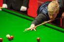 Neil Robertson of Australia plays a shot during the World Snooker Championship 2014 first round match at The Crucible in Sheffield on April 23, 2014