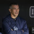 New York Yankees manager Joe Girardi looks out from the dugout as rain falls before a scheduled baseball game between the Yankees and the Cleveland Indians, Thursday, April 11, 2013, in Cleveland. The game was delayed due to rain. (AP Photo/Tony Dejak)