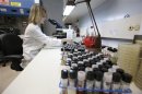 Tonya Snyder, a Mycology Specialist in the Vanderbilt Clinical Microbiology Lab for patient care examines samples to isolate and identify specimens for gorwth in Nashville, Tennessee