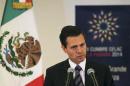 Mexico's President Enrique Pena Nieto addresses the media in Havana