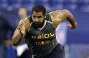 FILE - In this Feb. 22, 2014, file photo, Penn State offensive lineman John Urschel runs a drill at the NFL football scouting combine in Indianapolis. Urschel will routinely provide a look at his journey leading to the NFL draft on May 8 in a series of diary entries. (AP Photo/Michael Conroy, File)