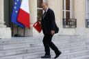 French Defence Minister Jean-Yves Le Drian arrives to attend a meeting at the Elysee Palace in Paris after Air Algerie flight AH 5017 crashed on Thursday en route from Ouagadougou in Burkina Faso to Algiers