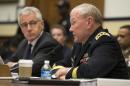 Joint Chiefs Chairman Gen. Martin Dempsey, right, accompanied by Defense Secretary Chuck Hagel, testifies on Capitol Hill in Washington, Thursday, Nov. 13, 2014, before the House Armed Services committee hearing on the Islamic State Group. (AP Photo/Evan Vucci)