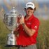 McIlroy lifts the Wanamaker Trophy after capturing the PGA Championship at The Ocean Course on Kiawah Island