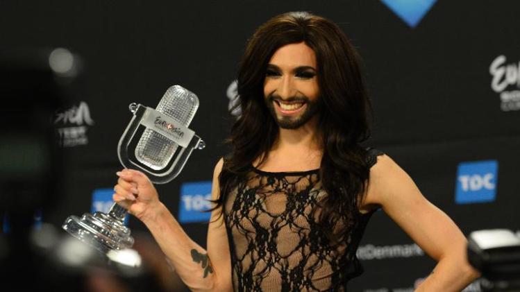 Conchita Wurst poses with the trophy after winning the Eurovision Song Contest 2014 Grand Final in Copenhagen, Denmark, on May 11, 2014