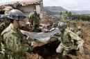 Japan Ground Self-Defense Force soldiers conduct search and rescue operation at a collapsed house at a landslide site caused by an earthquake in Minamiaso town, Kumamoto prefecture, Japan