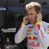 Red Bull Formula One driver Vettel covers his ears as he watches the European F1 Grand Prix from the pit wall of the Valencia street circuit