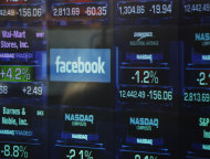 The Facebook logo appears on a display inside the NASDAQ Marketsite in Times Square Thursday, May 17, 2012, in New York. Facebook priced its IPO at $38 per share on Thursday, at the high end of its expected range. If extra shares reserved to cover additional demand are sold as part of the transaction, Facebook Inc. and its early investors stand to reap as much as $18.4 billion from the IPO. (AP Photo/Frank Franklin II)