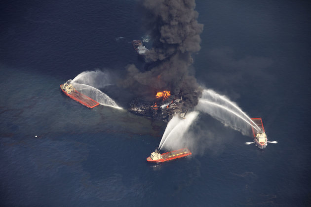 FILE - In this aerial file photo madeWednesday, April 21, 2010 in the Gulf of Mexico, more than 50 miles southeast of Venice on Louisiana's tip, an oil slick is seen as the Deepwater Horizon oil rig burns. Nearly three years after the deadly rig explosion in the Gulf of Mexico triggered the nation's worst offshore oil spill, a federal judge in New Orleans is set to preside over a high-stakes trial for the raft of litigation spawned by the disaster on Monday Feb. 25, 2013. (AP Photo/Gerald Herbert, file)