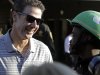 Part-owner of Kentucky Derby hopeful Goldencents Rick Pitino, left, talks to jockey Kevin Krigger at Churchill Downs Wednesday, May 1, 2013, in Louisville, Ky. (AP Photo/Garry Jones)
